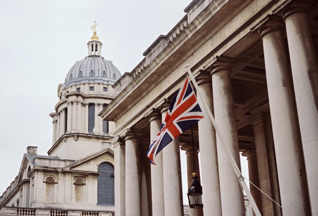 a-british-flag-flying-in-front-of-a-building-0qy4o2fsk60